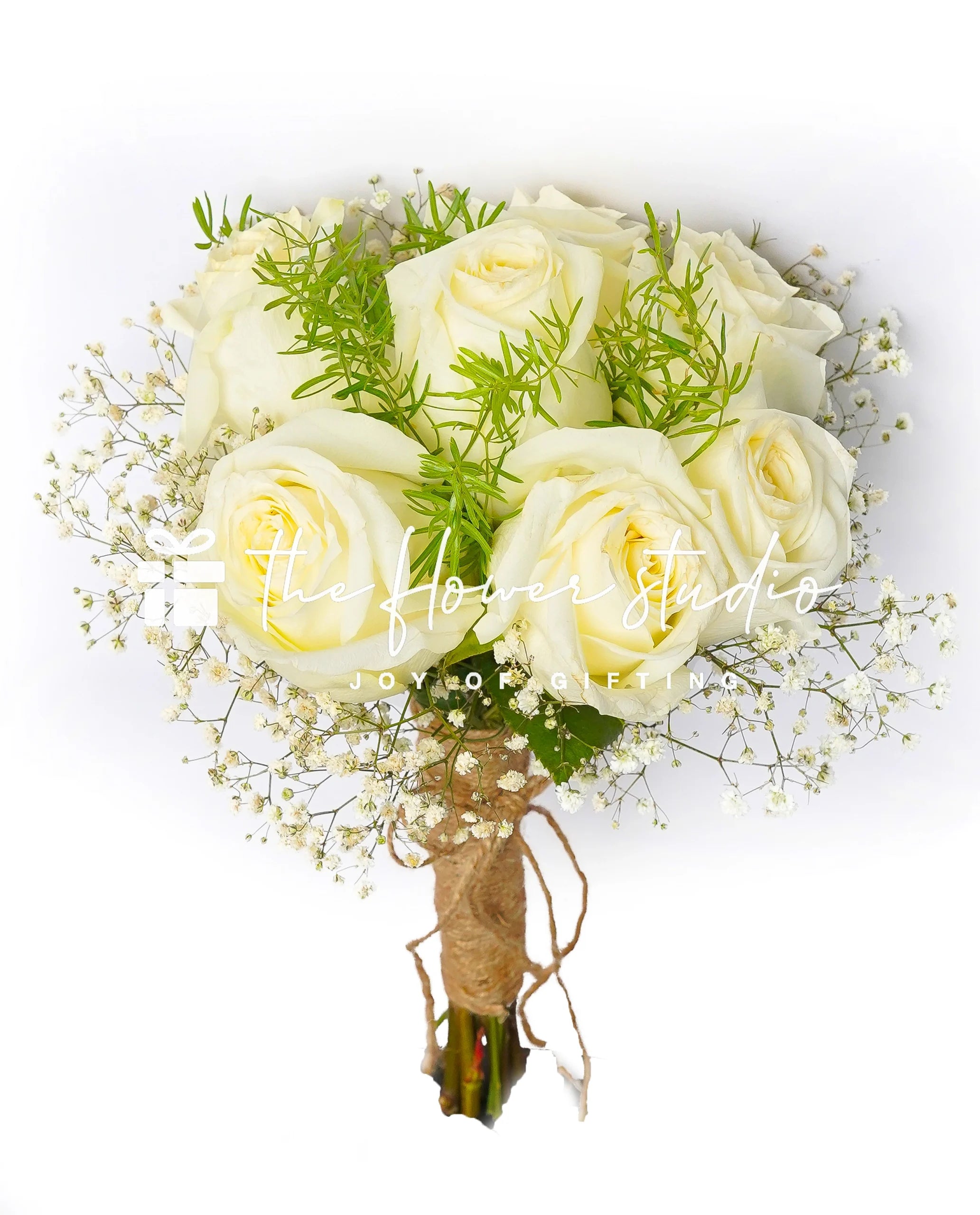 A hand-tied white rose bridal bouquet, featuring imported white roses with baby's breath flowers wrapped in jute. 