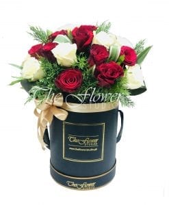 red and white hatbox with flowers